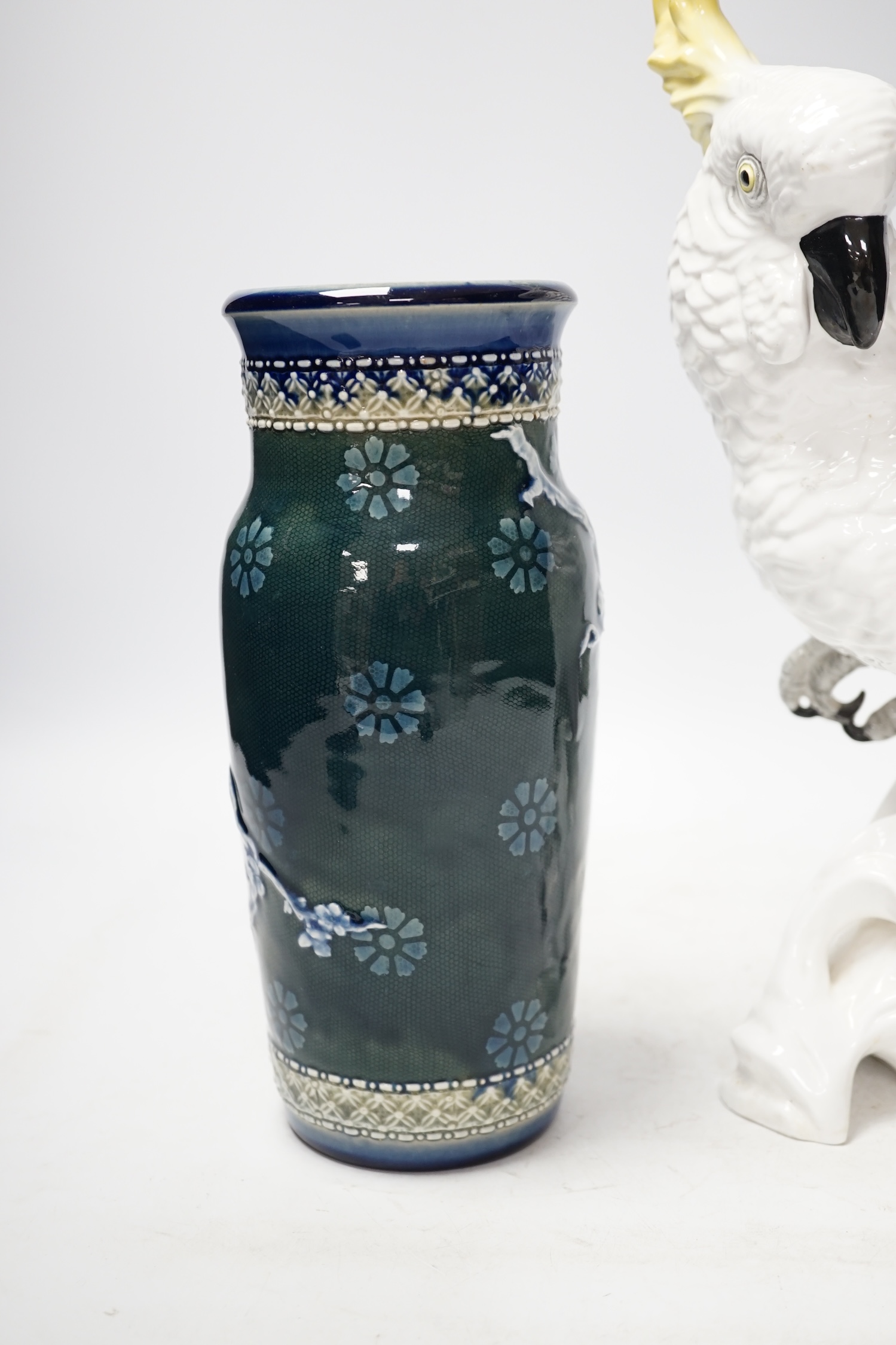 A Doulton and Slater’s patent stoneware vase and a Royal Staffordshire porcelain figure of a cockatoo, 33cm high. Condition - poor to fair condition, significant cracks to cockatoo